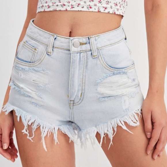 Distressed frayed hem light wash denim shorts